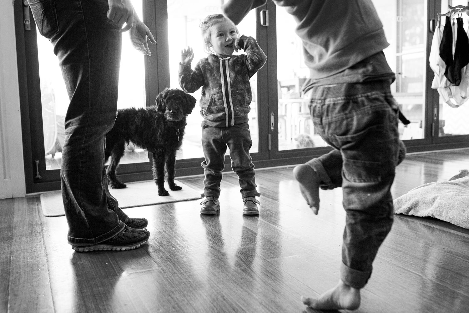 A series of black and white photos showing legs and feet in motion against a light colored floor.