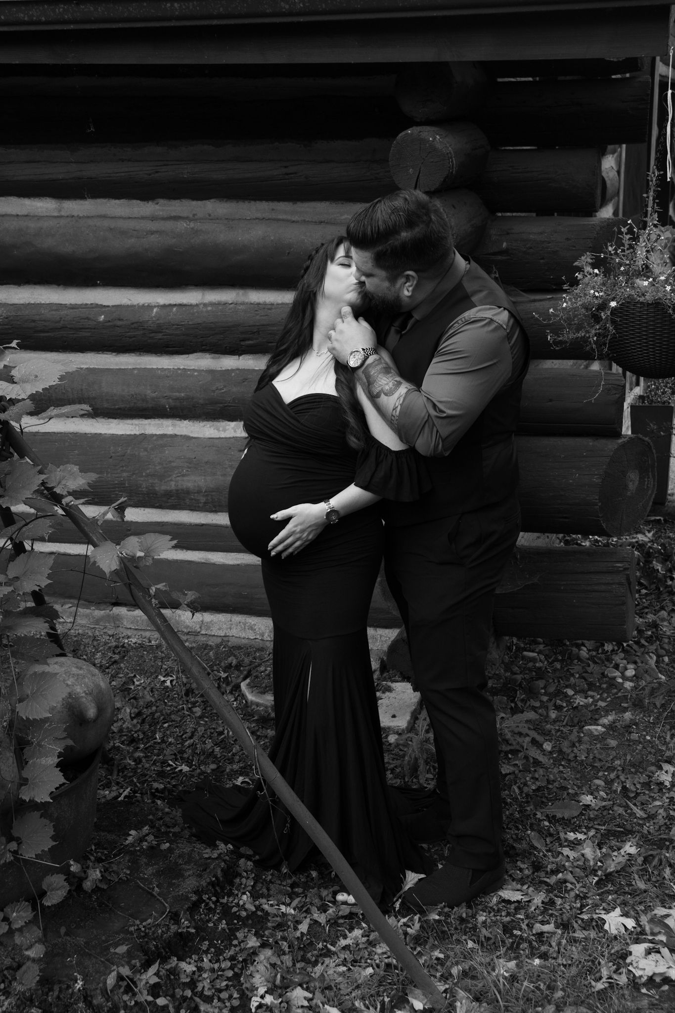 A romantic black and white photo sequence shows a couple embracing and dipping in an outdoor garden setting.