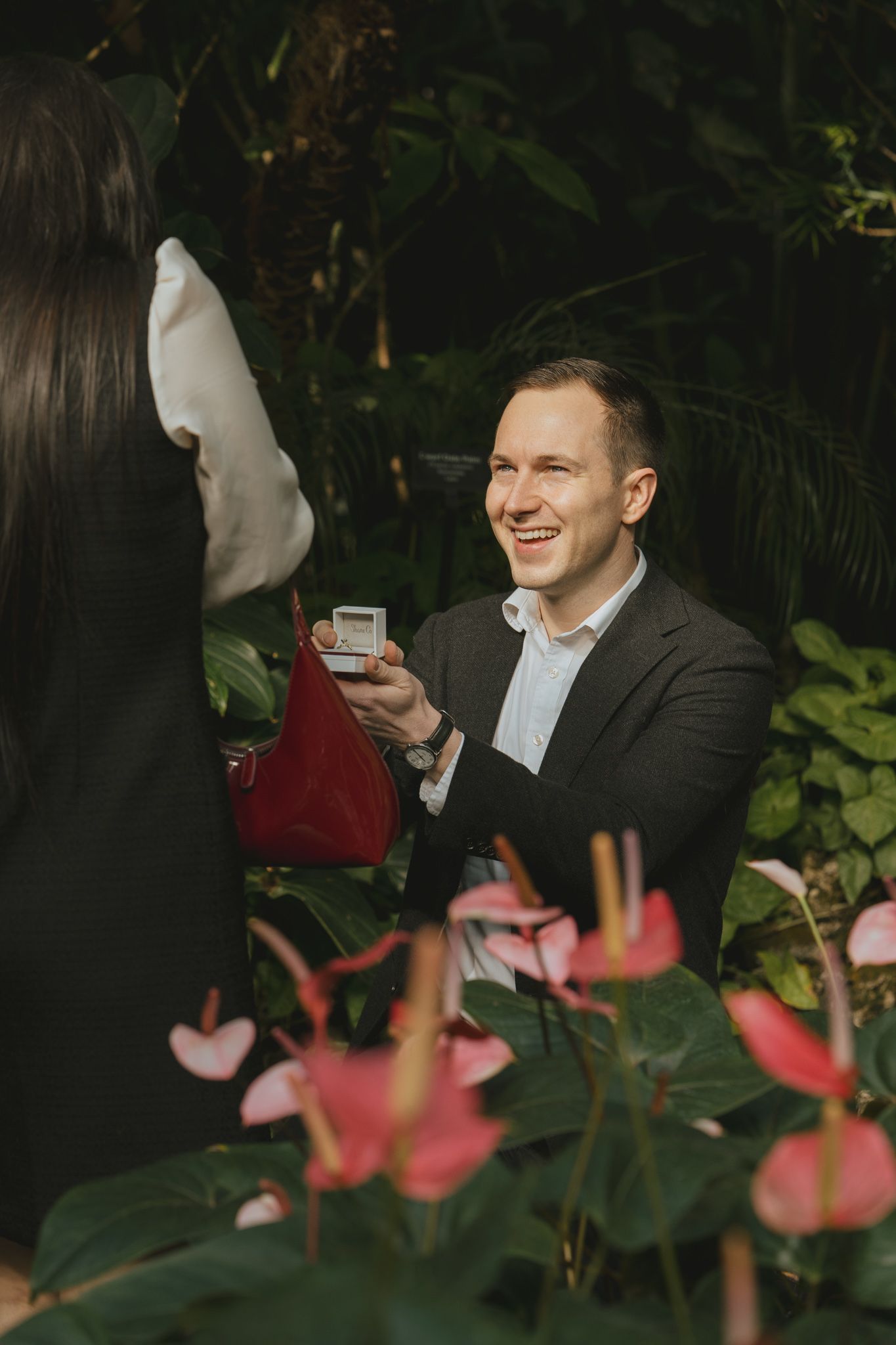 A candid sequence of joyful moments captured in a garden setting with pink flowers in the foreground.