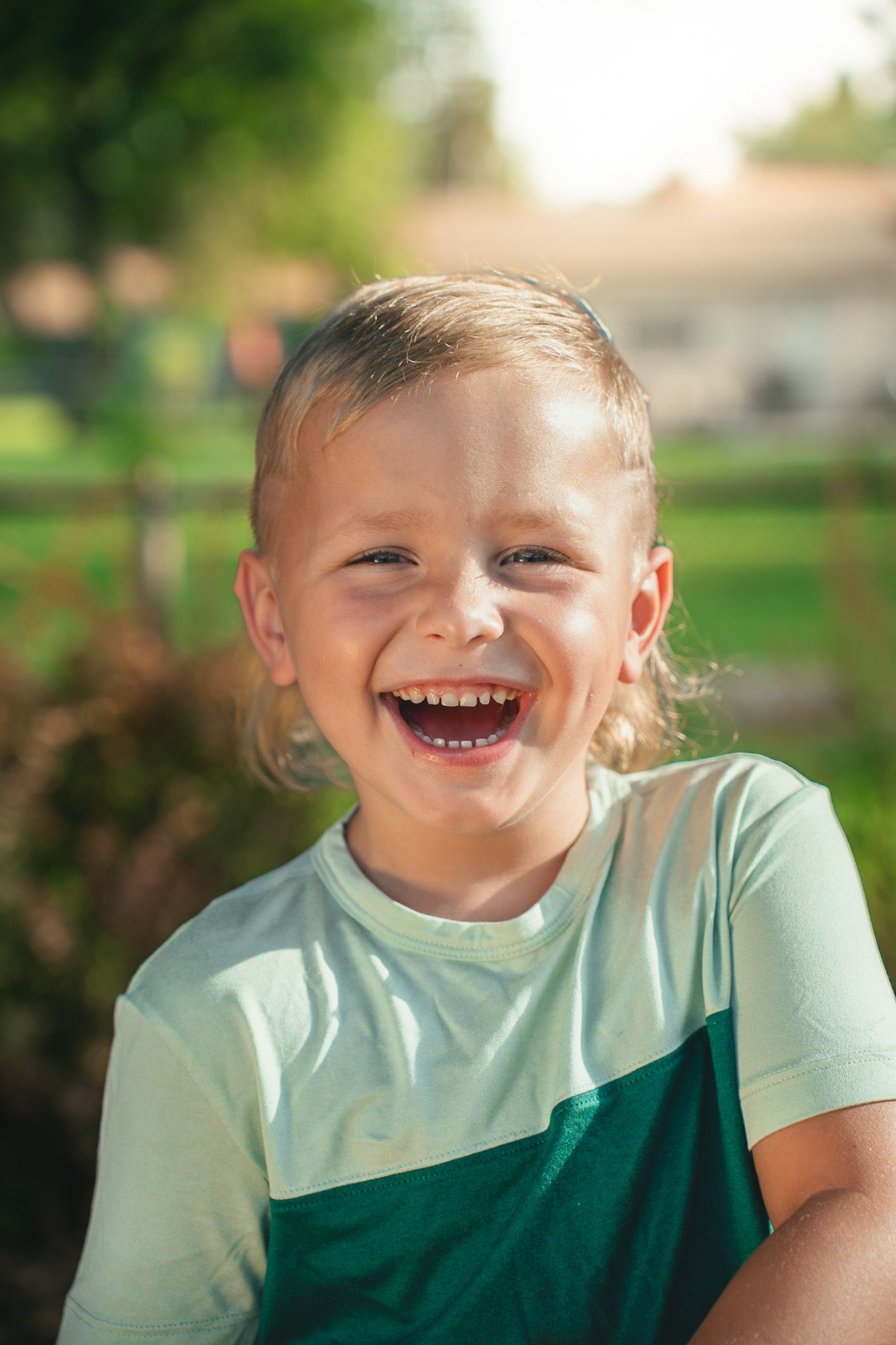 A joyful candid portrait outdoors on a sunny day.