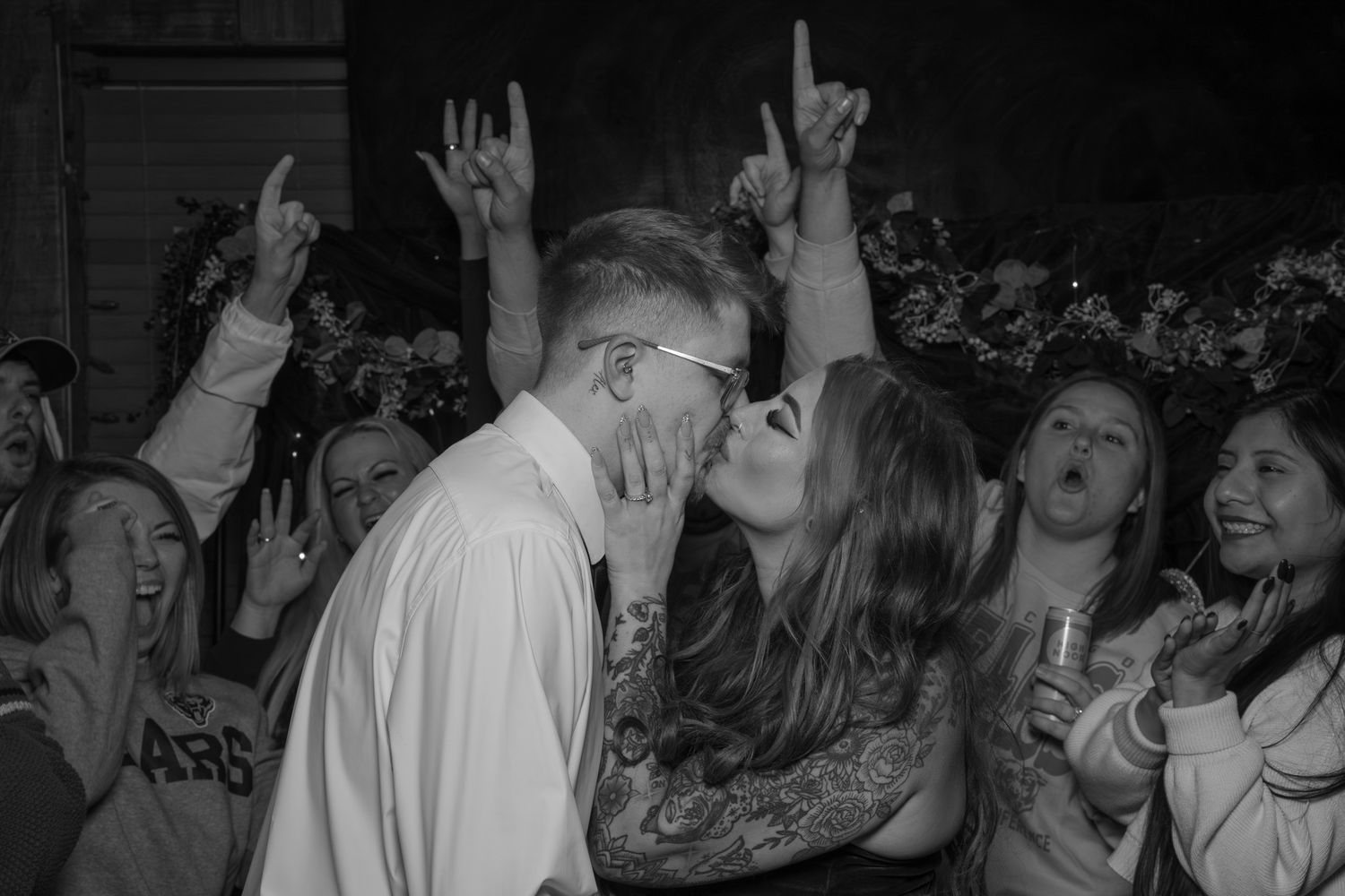 Black and white photographs show people dancing and celebrating at what appears to be a party or social gathering.