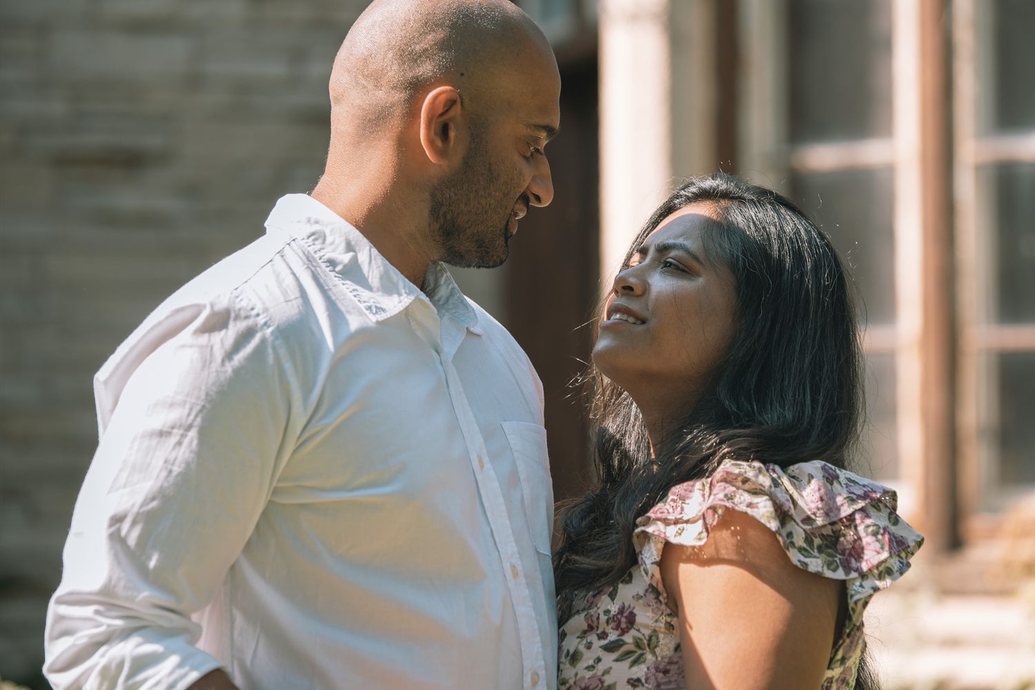 An intimate portrait session captures sweet moments between a couple.