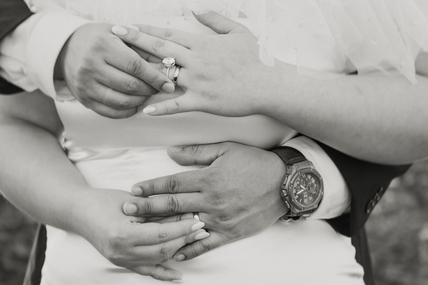 Hands of bride and groom showing wedding rings