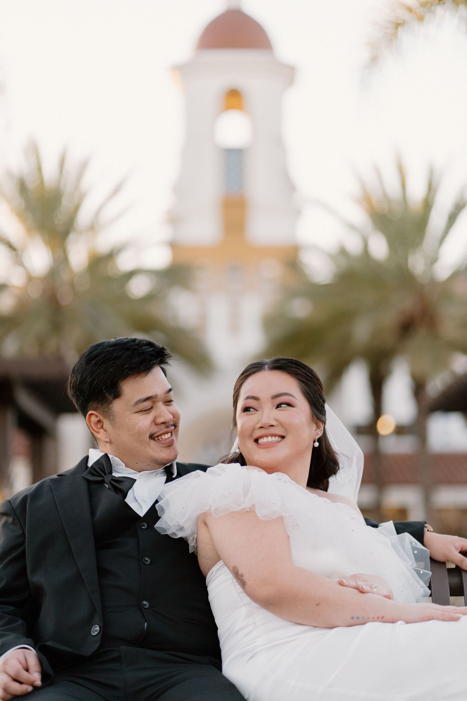 Couple sitting on bench in front of Laguna Hills Civic Center