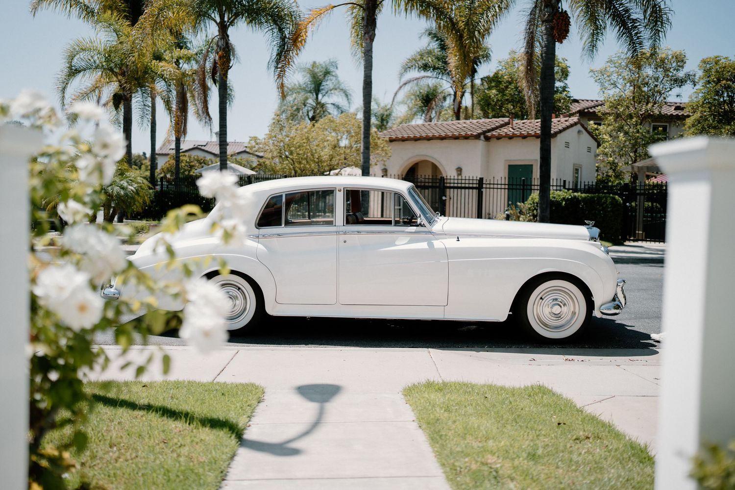 Bentley classic getaway car waiting for the bride and groom after ceremony