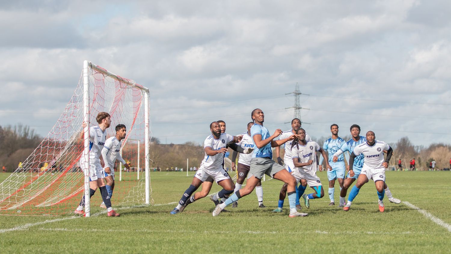 Soccer players compete in an intense match sequence showing multiple game moments on a grass field.