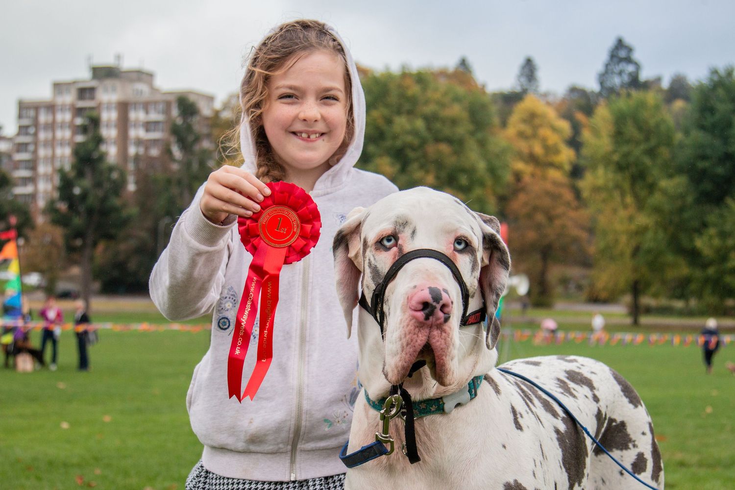 Young girl  poses with her Dalmatian dog who won a compettion in Brighton.