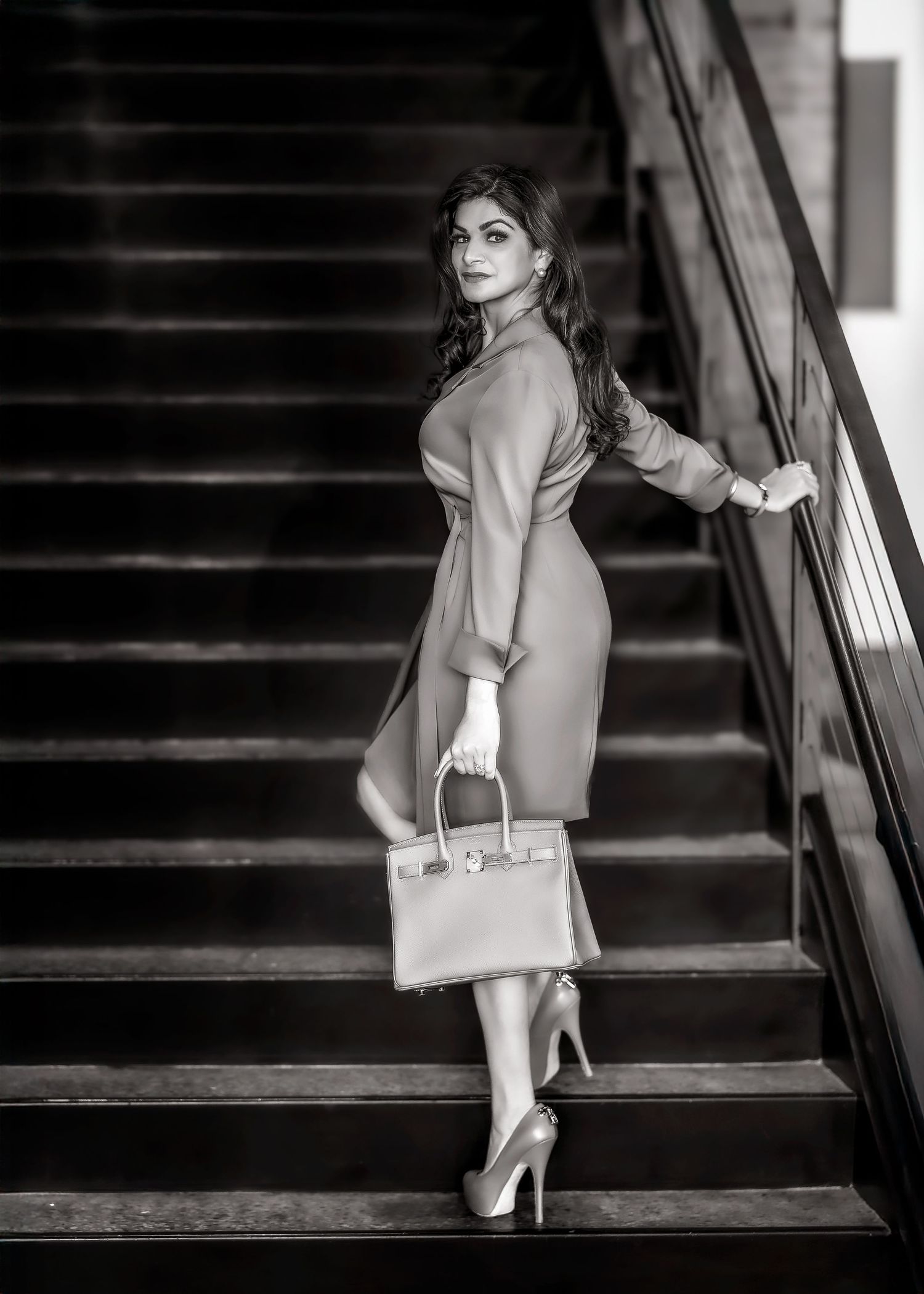 CEO,black and white, headed to work up the stairs