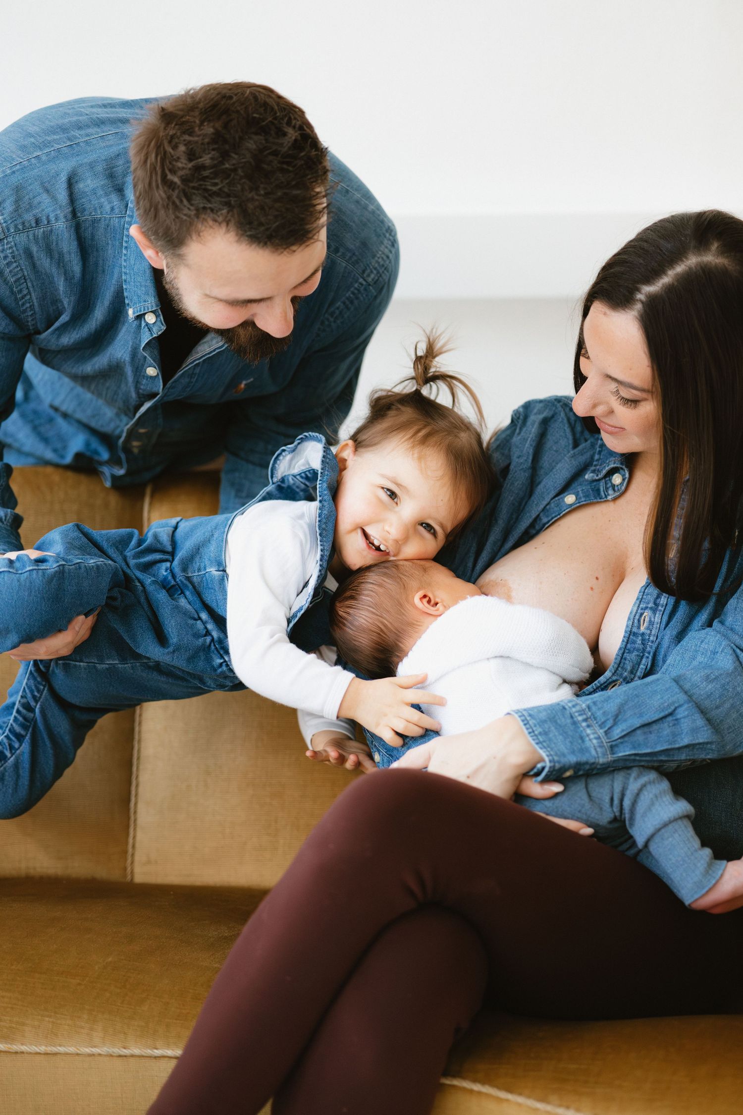 A sequence of intimate family moments showing parents cuddling with their young child on a couch.