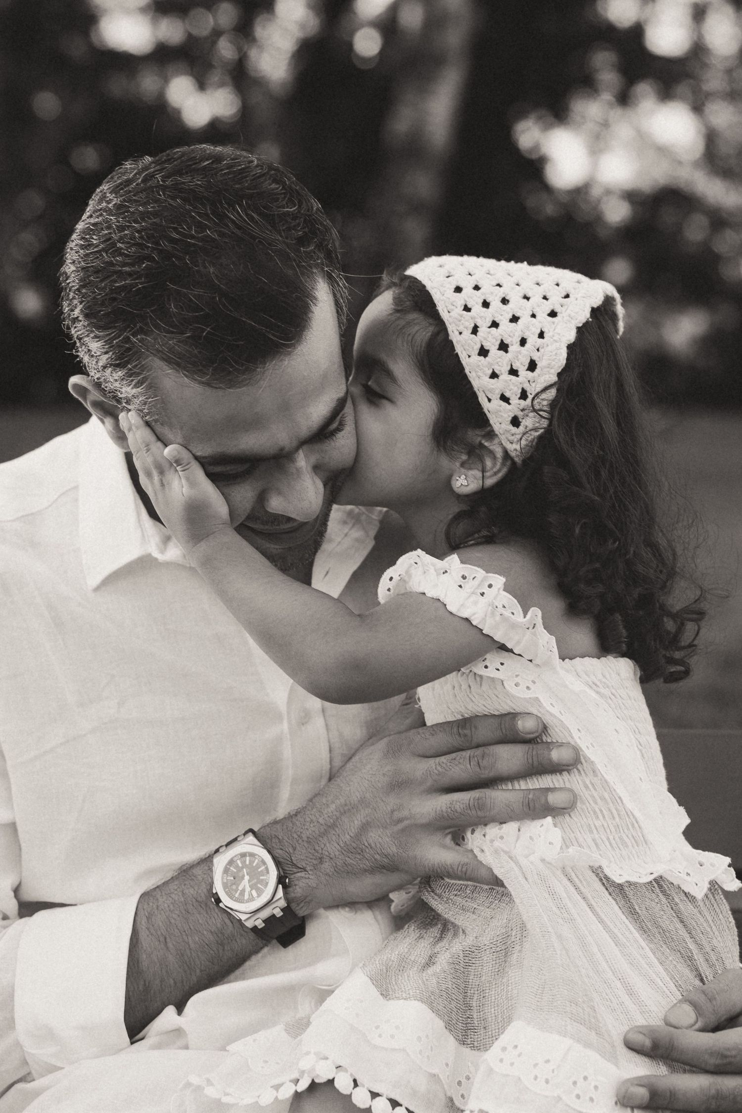 Black and white romantic wedding photo sequence showing tender moments between newlyweds in lace attire.