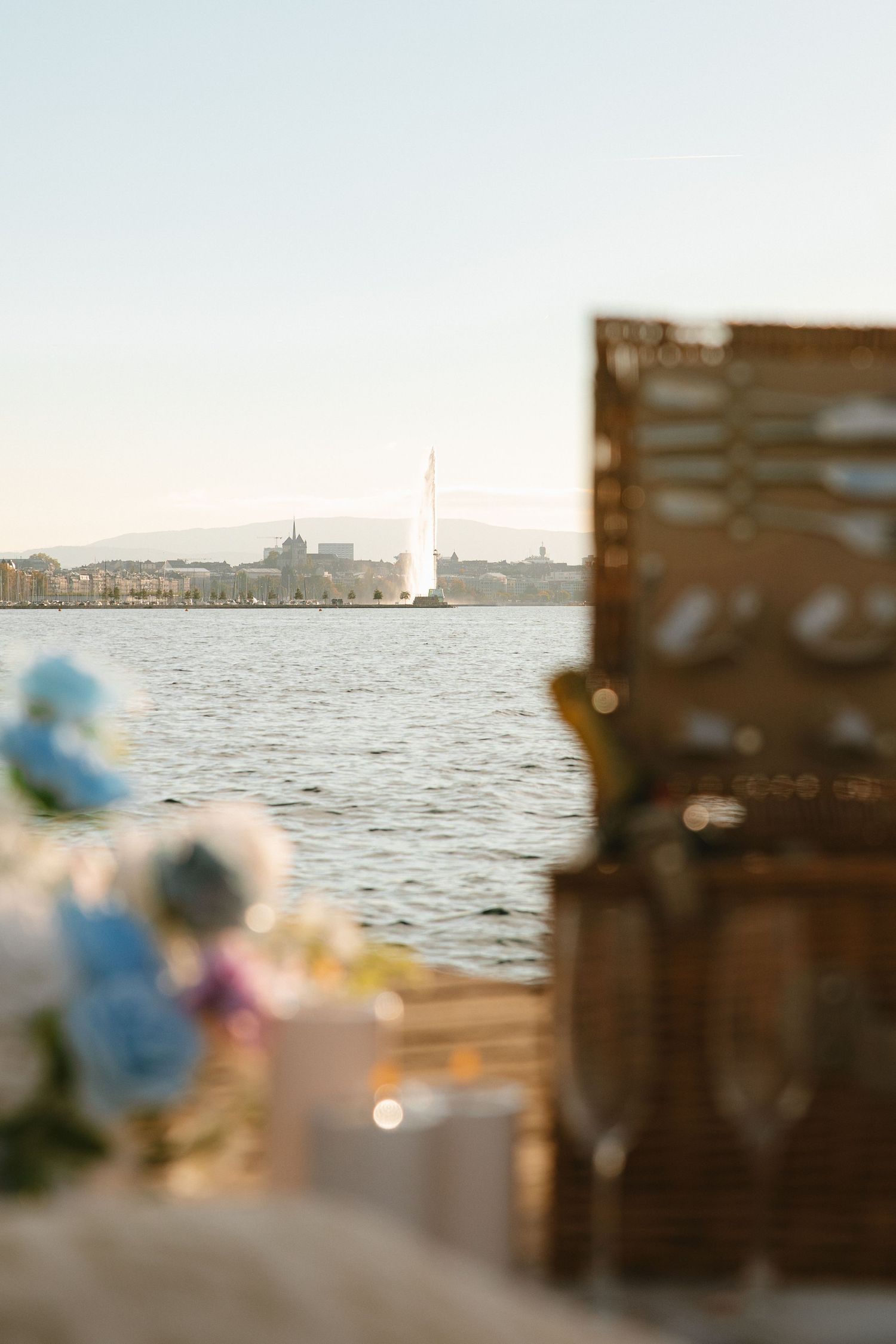 A series of blurred seaside images showing a waterfront view with soft bokeh effects and decorative elements.