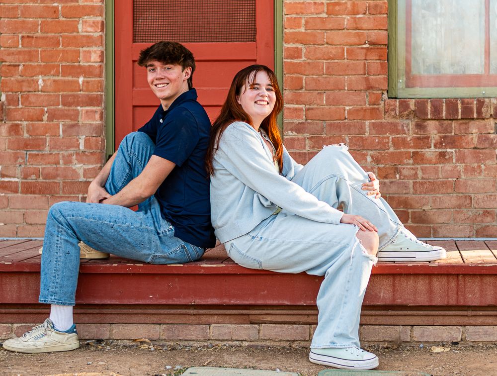 Phoenix senior portrait photographer - brother and sister sibling session at outdoor brick wall location