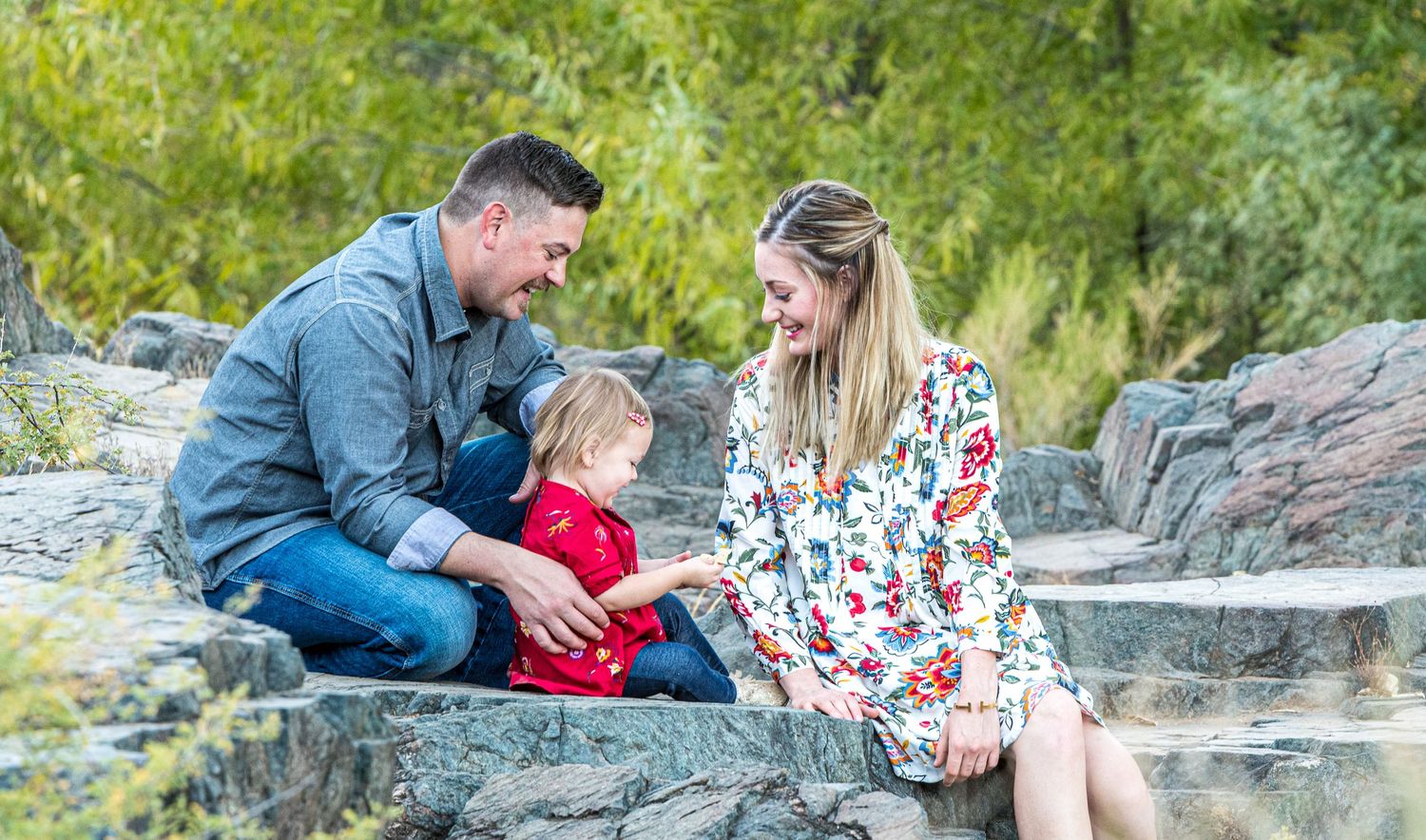 Moon Valley family photographer - couple with toddler at outdoor portrait session on rock steps in Phoenix AZ