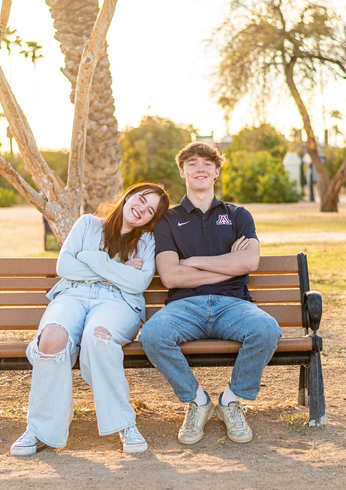 North Phoenix senior portrait photographer - high school seniors sitting together at outdoor park bench session