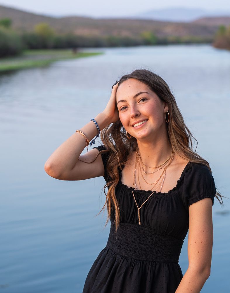 Phoenix AZ senior portrait photographer - high school senior girl in black dress by scenic waterfront