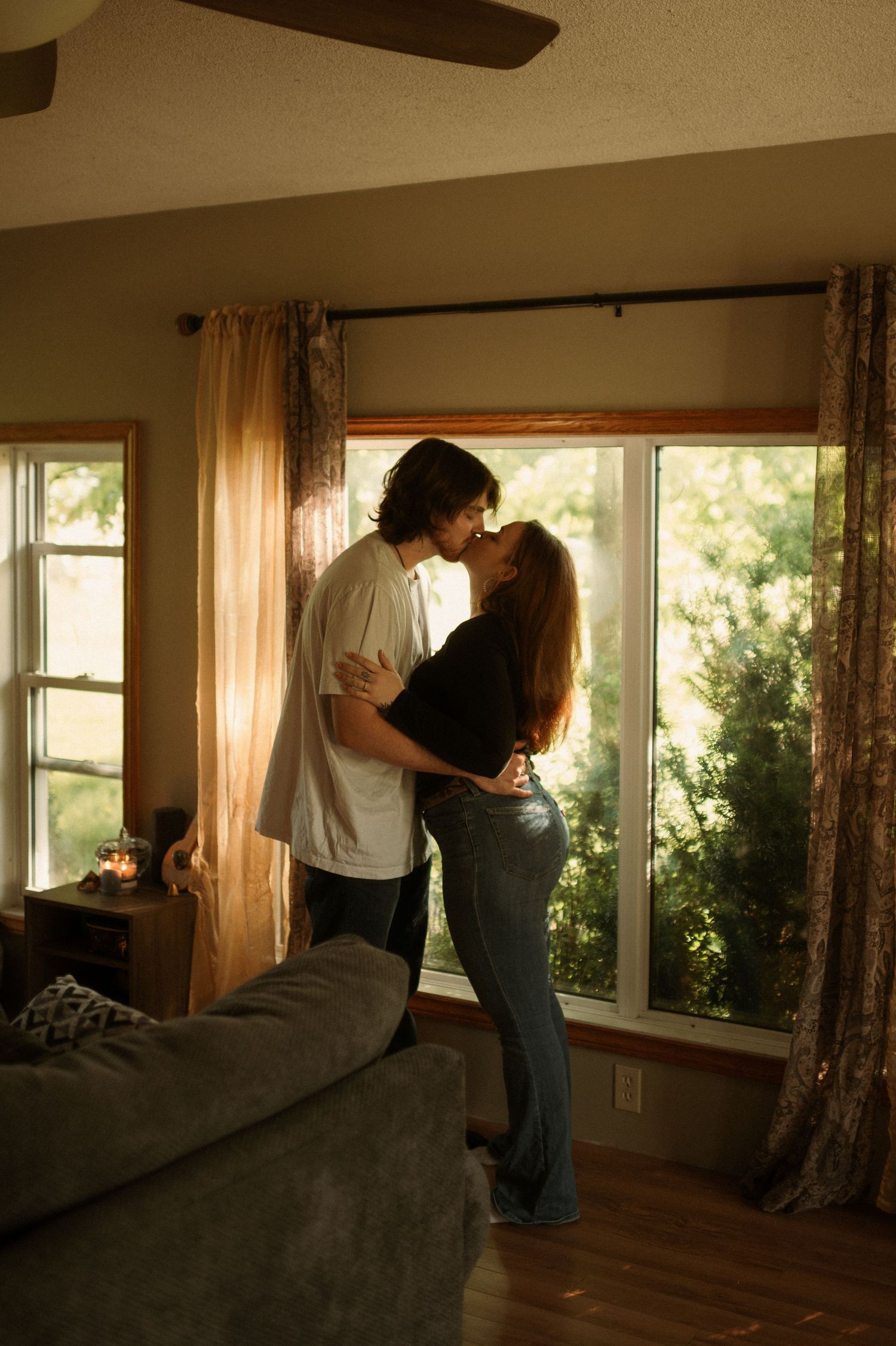 couple kissing in their living room