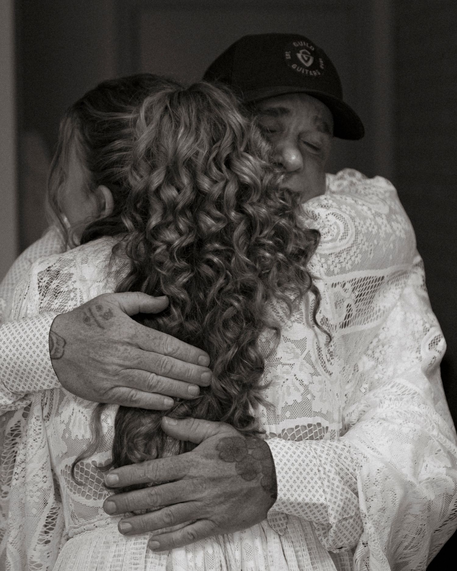 an emotional embrace between father and bride during their first look on her wedding day