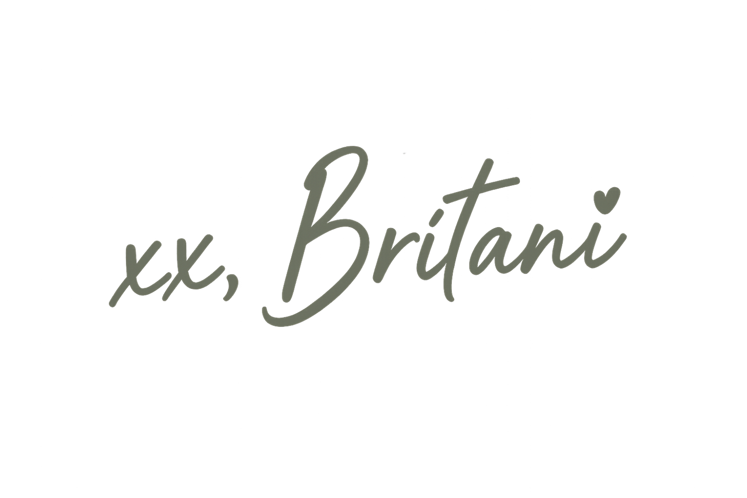 A signature in black ink appears handwritten on a light colored surface.