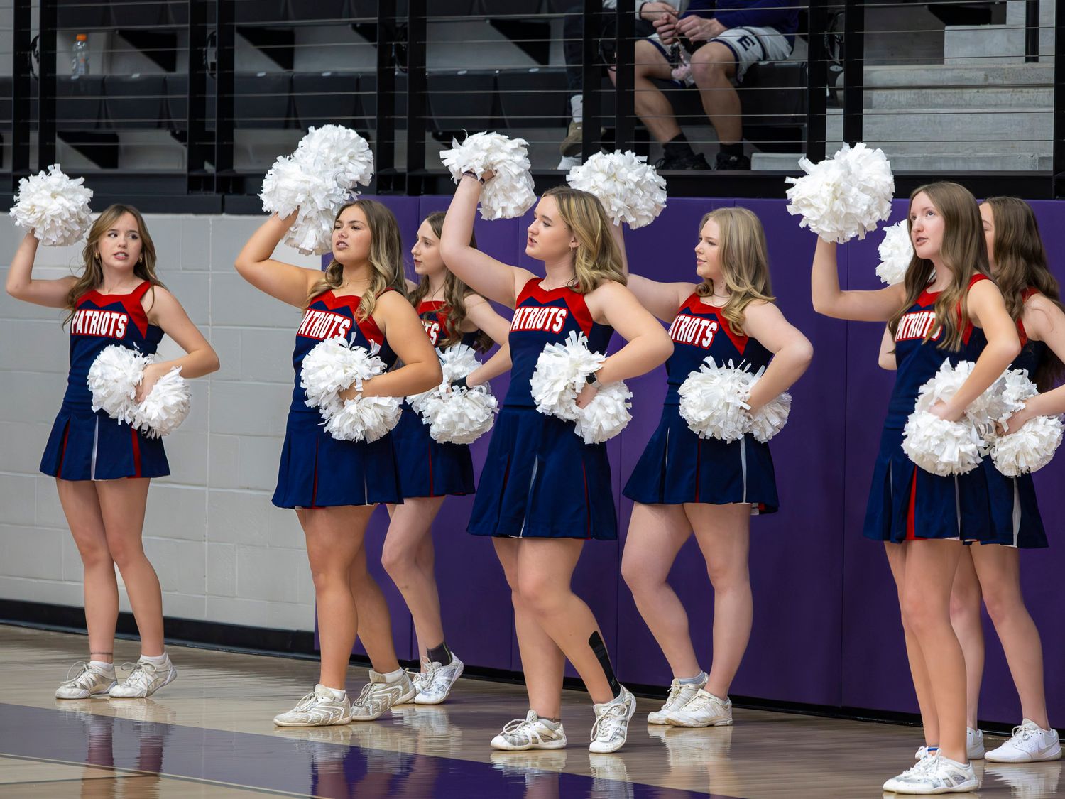 Cheerleaders from Rogers Arkansas perform at a basketball game in Elkins Arkansas. Photo taken by Trevel Young Photography