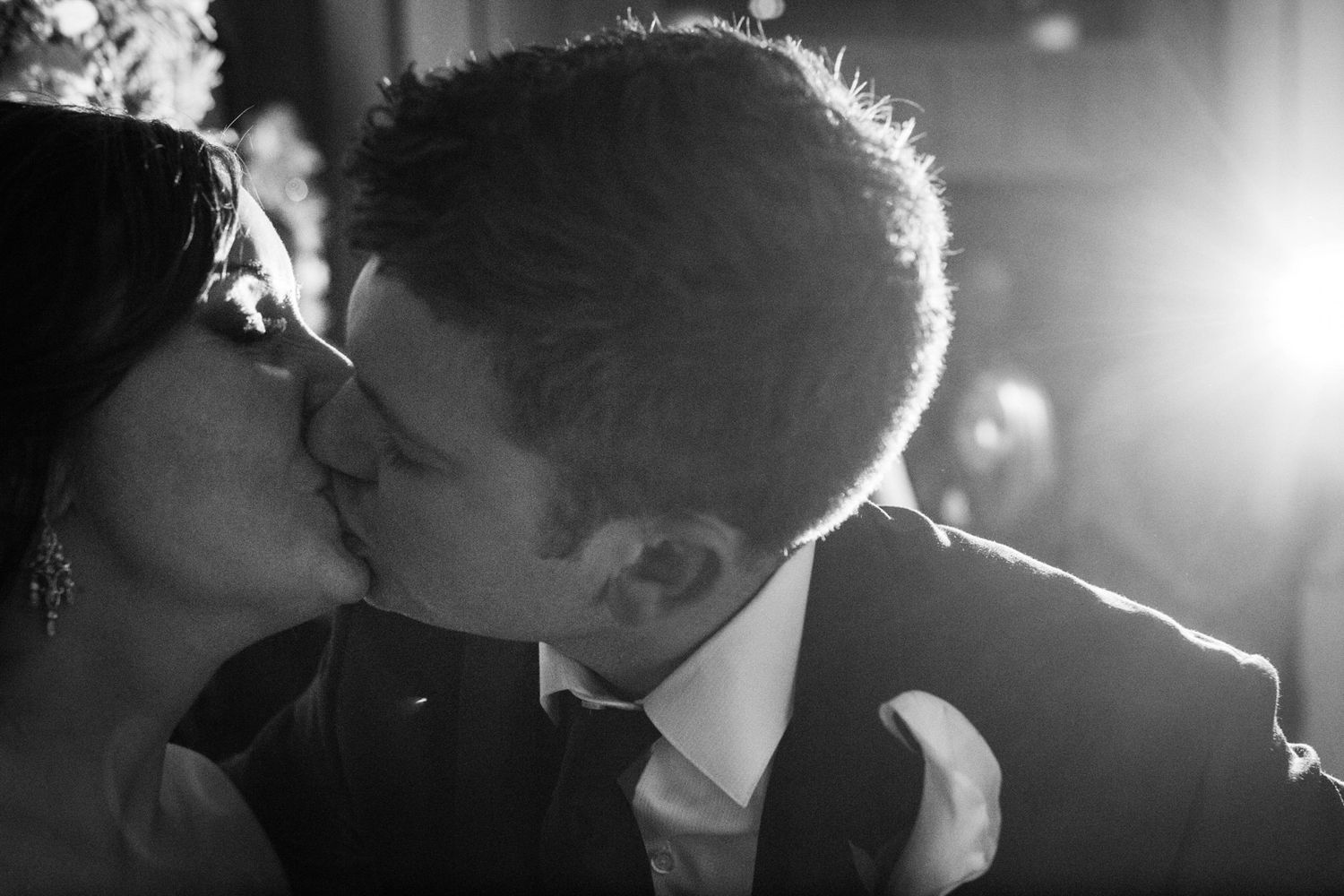 too close kiss of a couple at a wedding