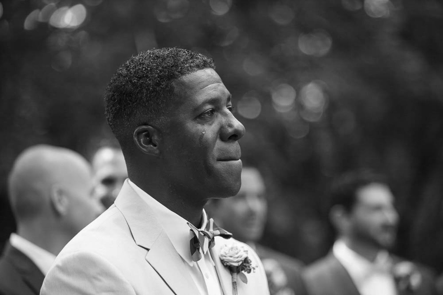 groom crying during a wedding ceremony