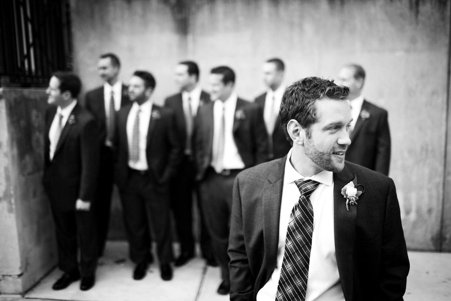 a groom and his groomsmen waiting for a bus, fun moment