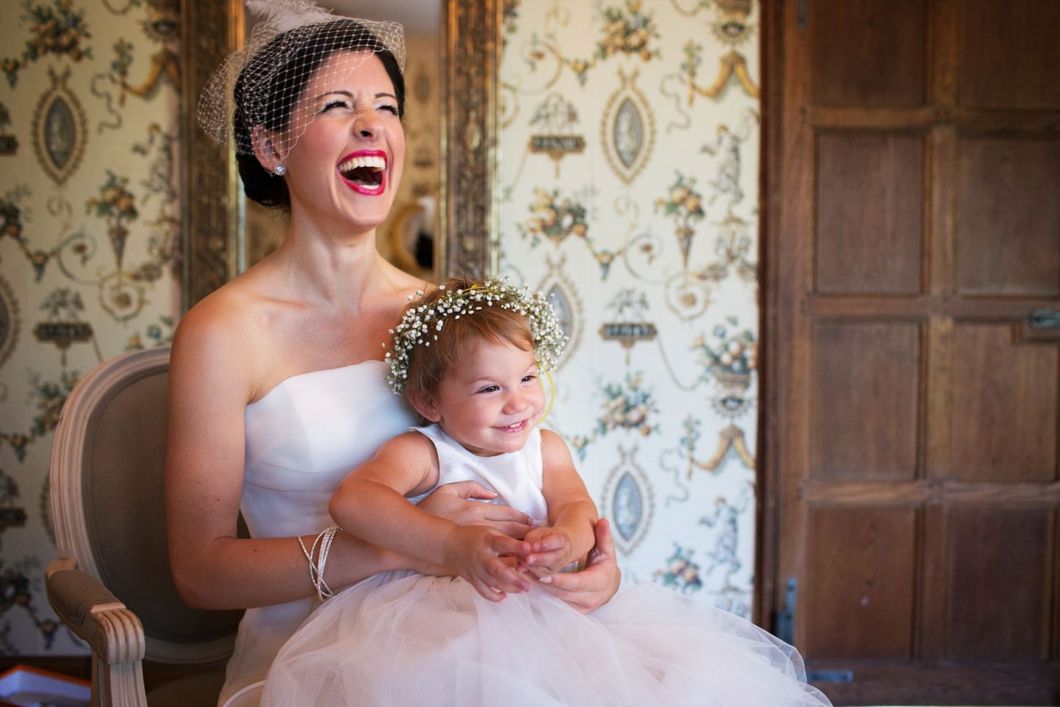 bride and girl on her lap