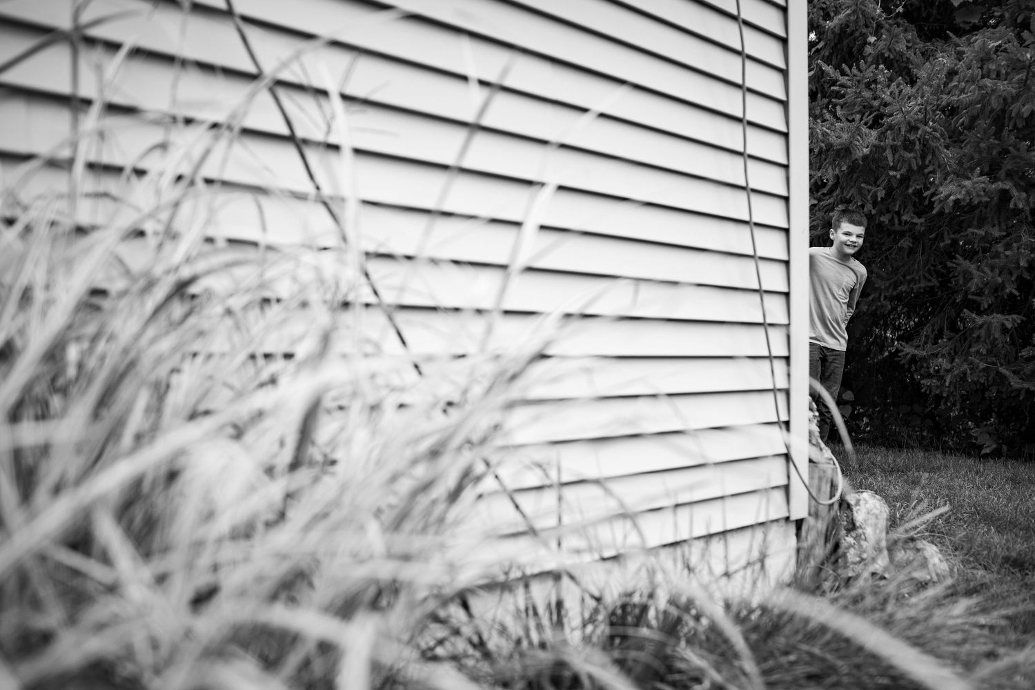 Black and white architectural detail showing horizontal siding patterns and textures.