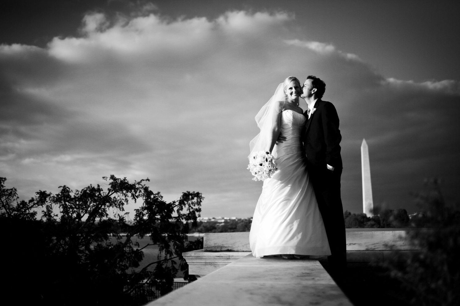 photo of a bride and groom with the Washington Monument