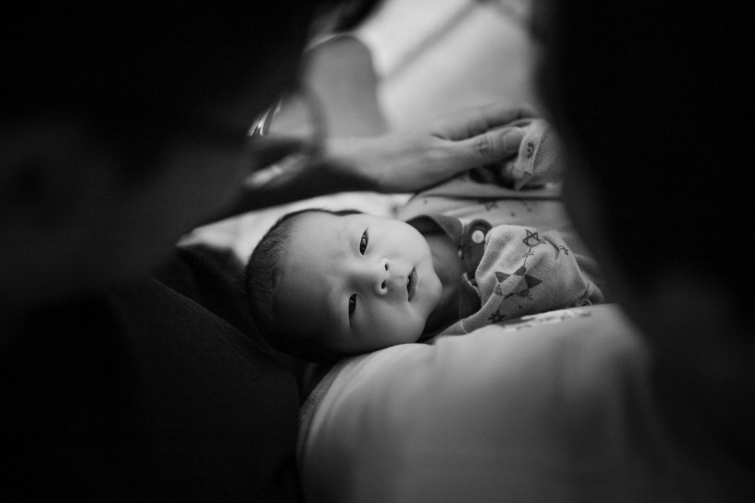 A black and white photo series shows peaceful moments and emotions in dark lighting and shadow.