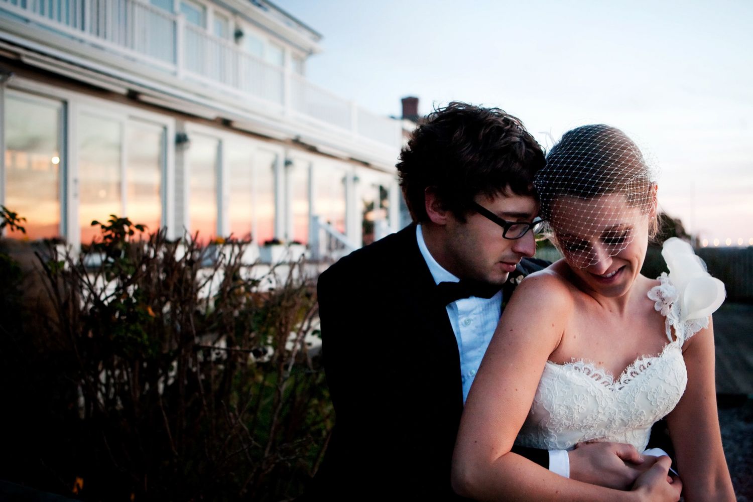 couple at sunset by windows