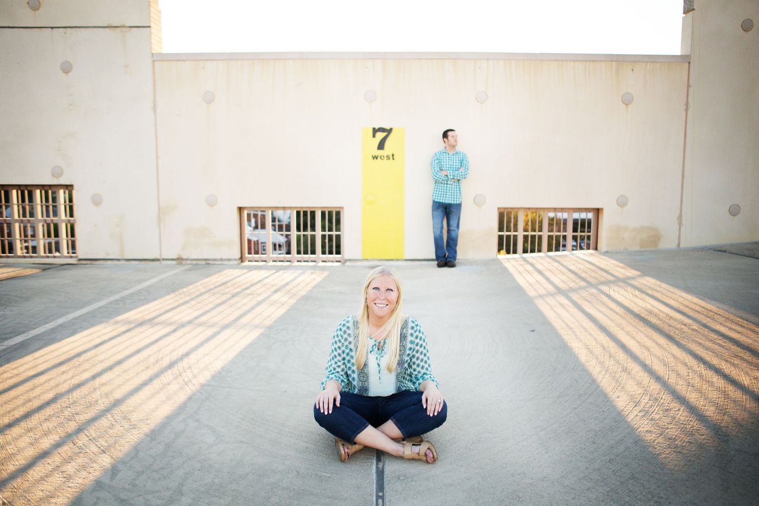Creative engagement photo with shadows and interesting composition in a parking structure.