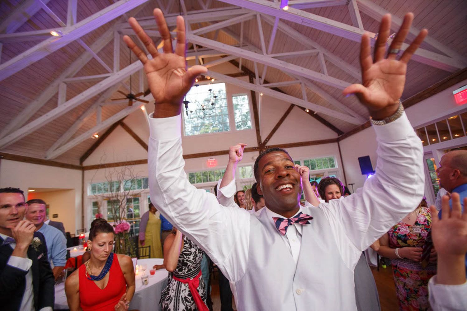 groom dancing hands in the air
