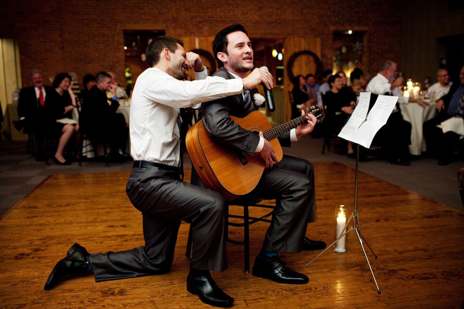 guy holding a mic for a guitarist