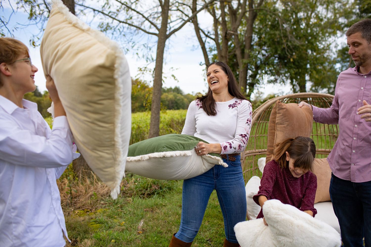 A series of candid outdoor photos showing people dancing and celebrating together in a natural setting.