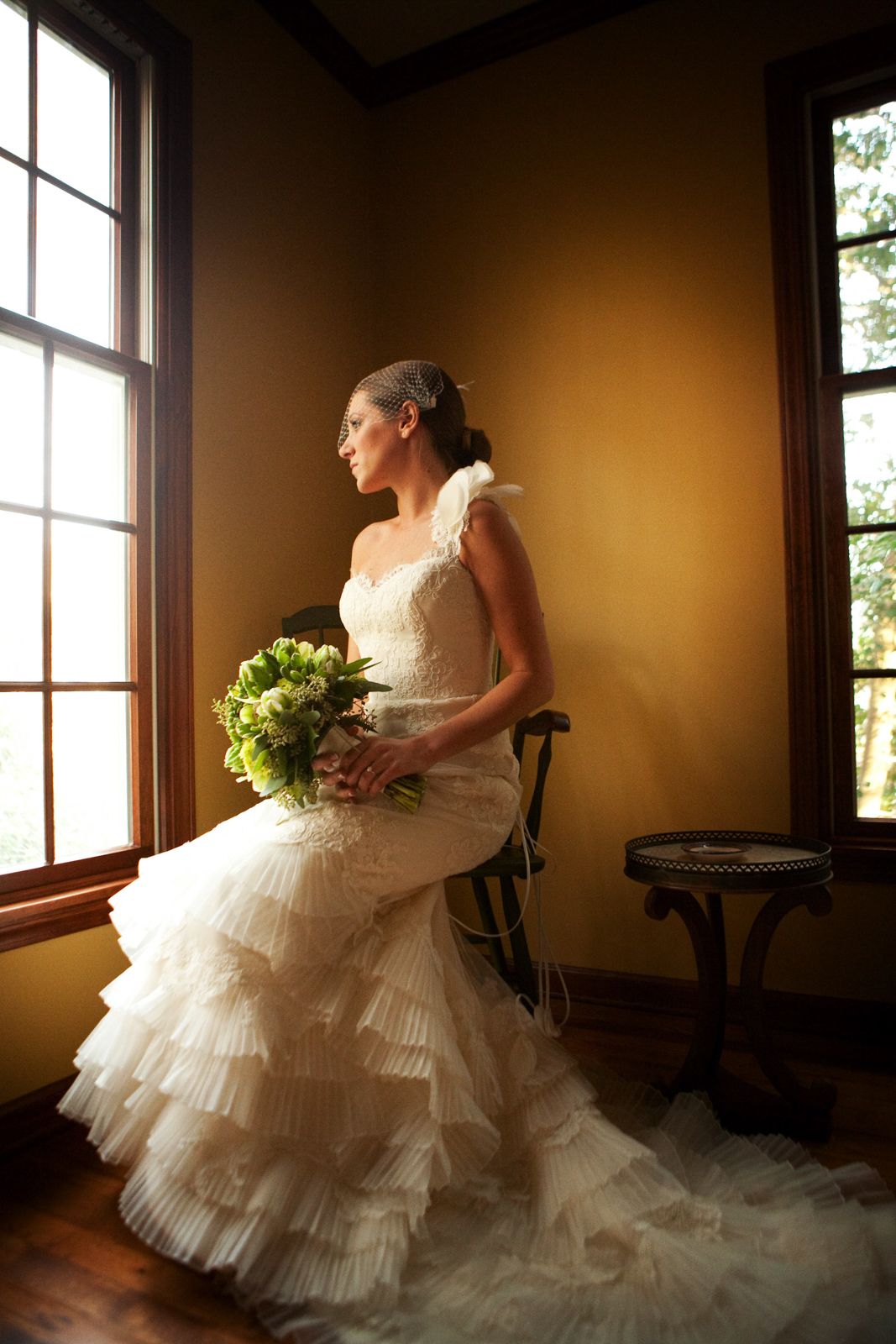 bride by a window in warm light