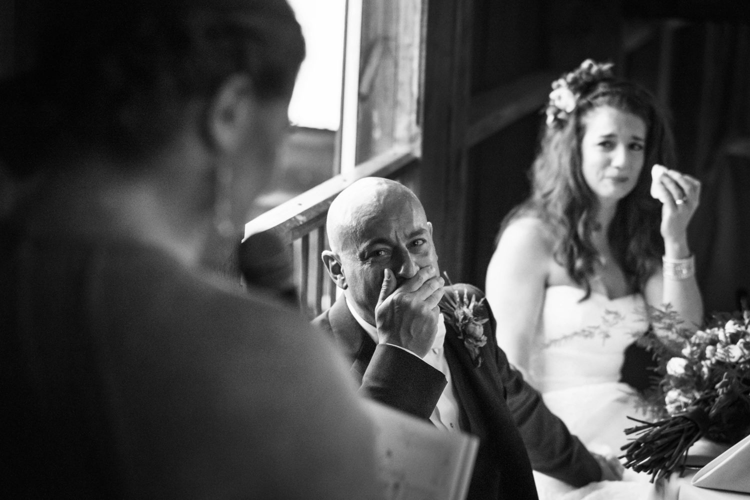 groom and bride crying during a speech