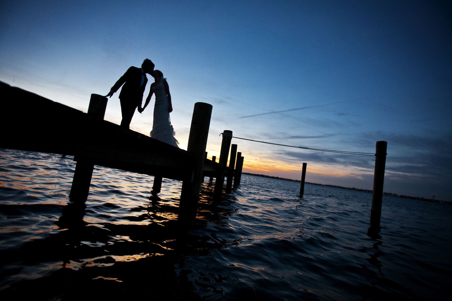 A unique silhouette portrait on a pier