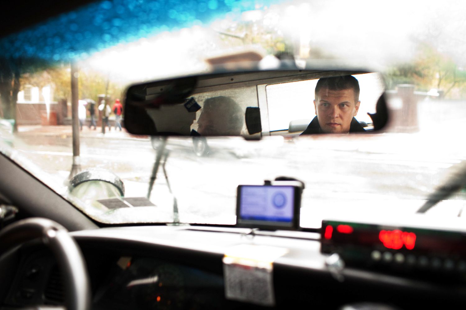 groom in a rearview mirror