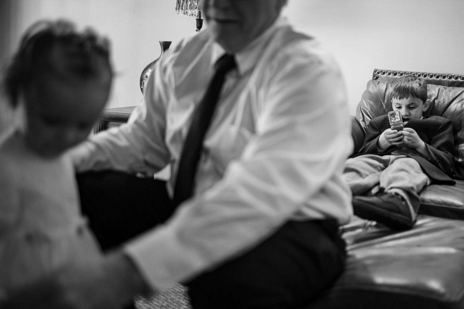 Six black and white photos show a baby getting medical treatment or examination in a hospital setting.