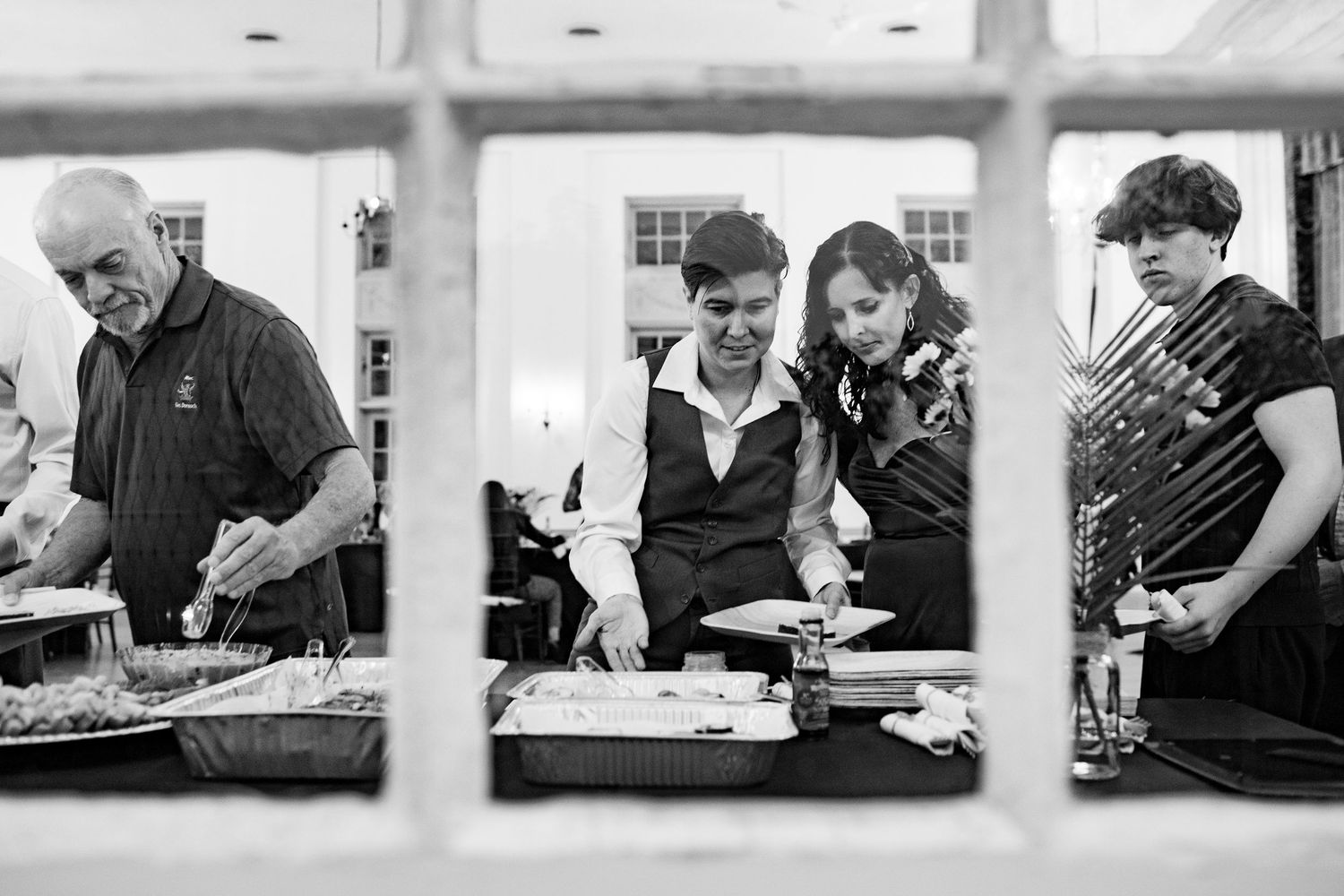 Black and white photo series showing people collaborating at tables during a workshop or meeting.