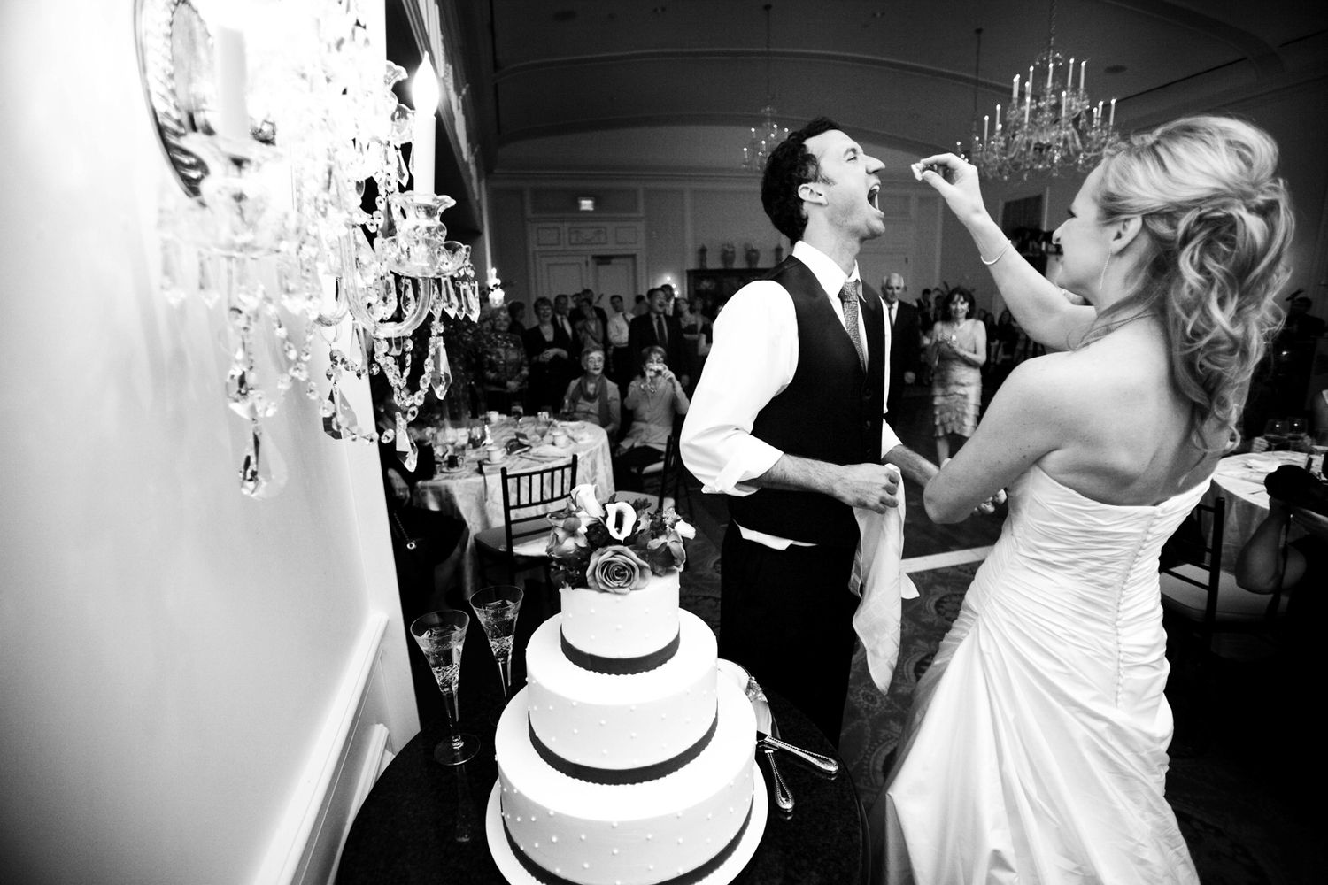 bride feeding cake to the groom