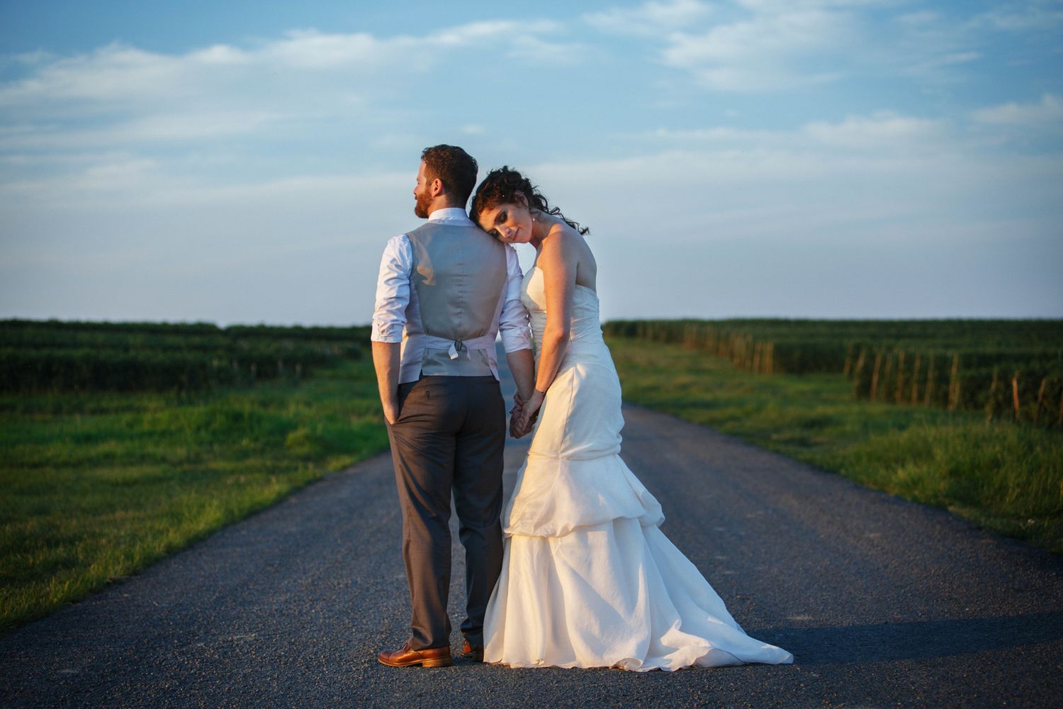 bride resting her head on the groom's shoulder