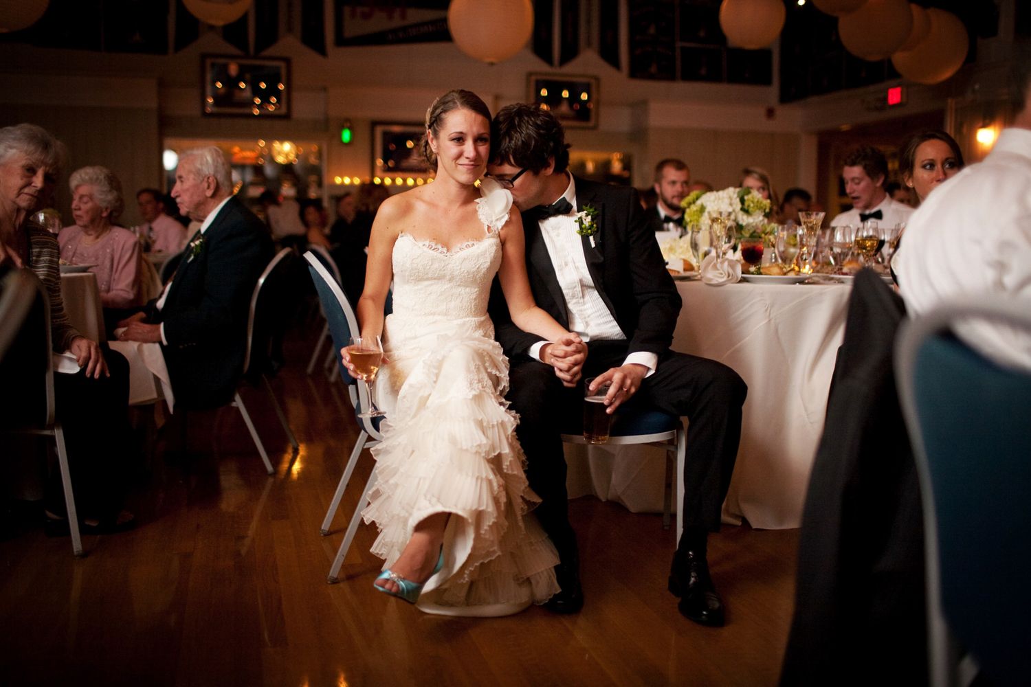 groom kissing bride's shoulder