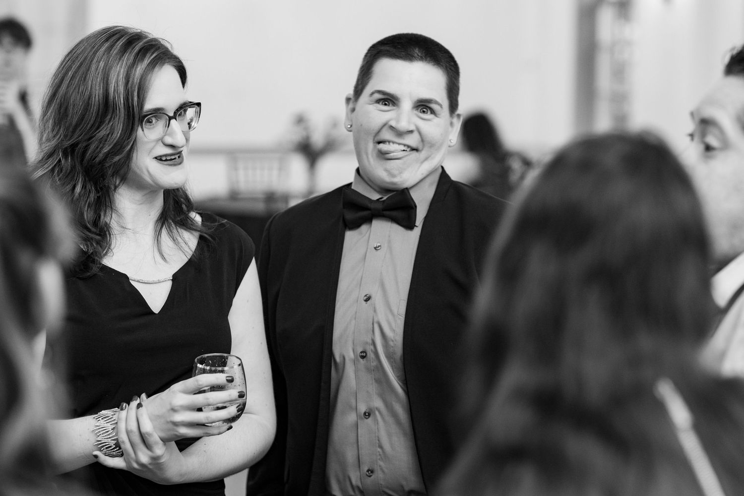 Black and white wedding photo collage showing candid moments of celebration and dancing at a reception.