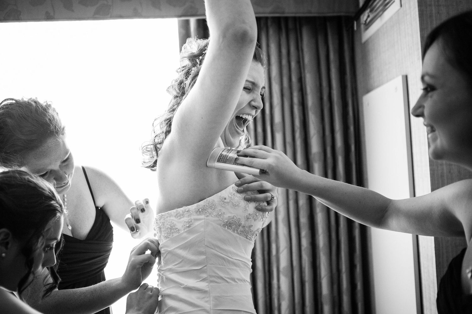 bride laughing during prep