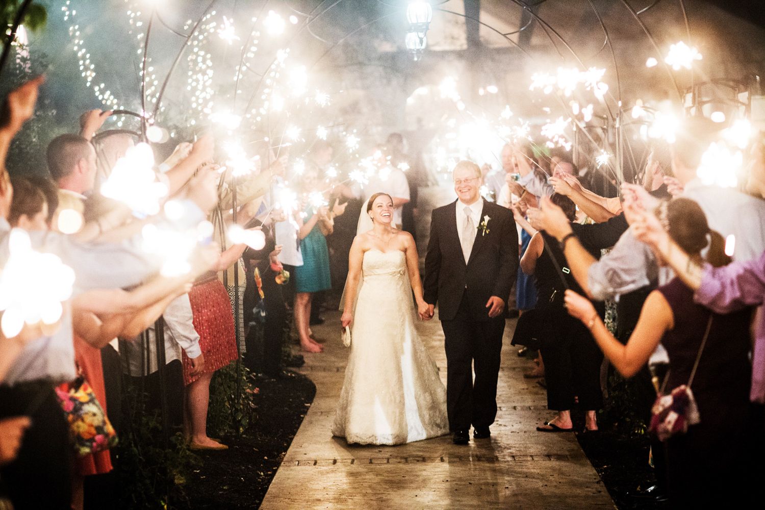 sparkler exit from a wedding bride and groom heading to the honeymoon