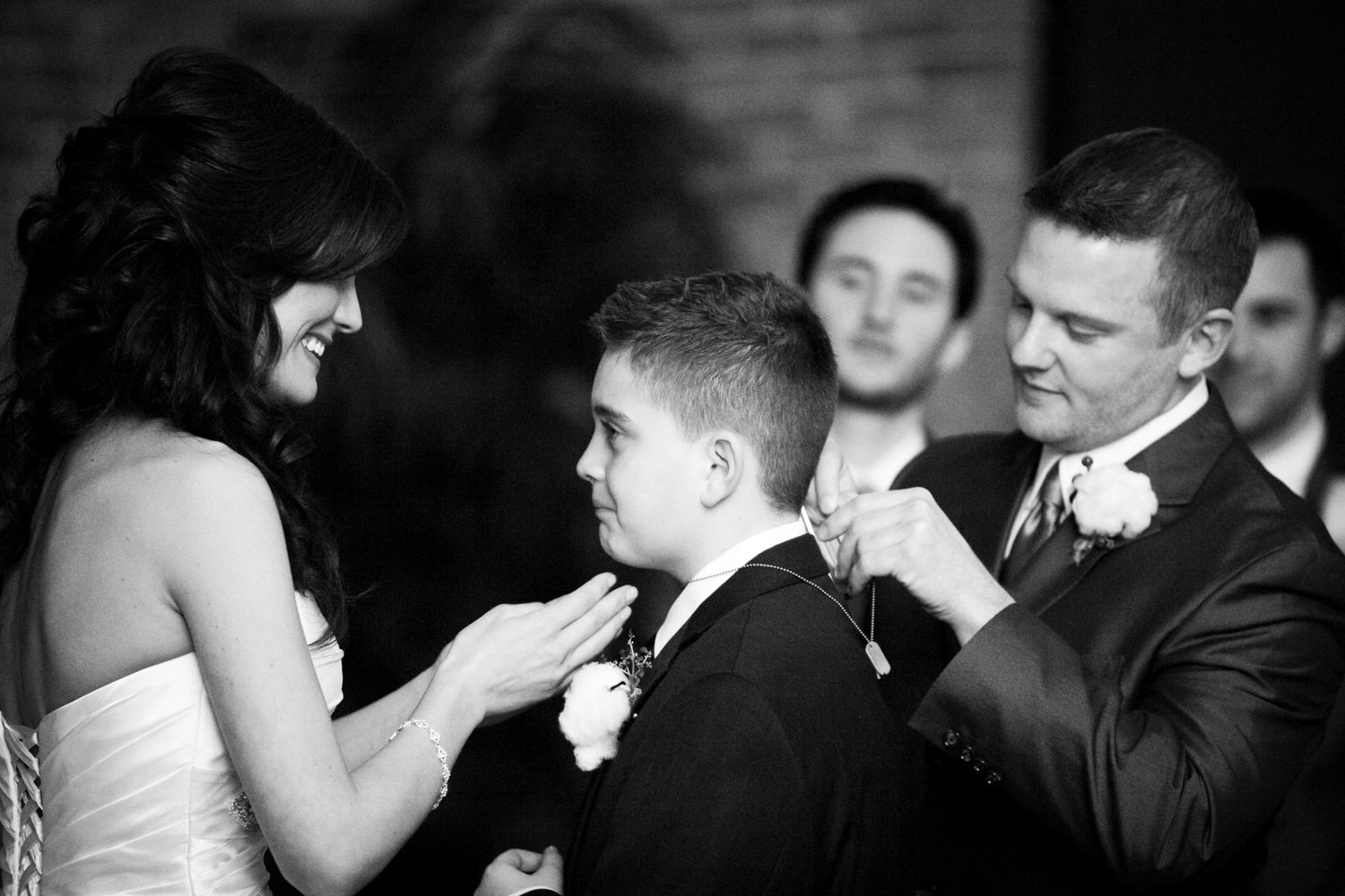 putting something on a kid during the ceremony