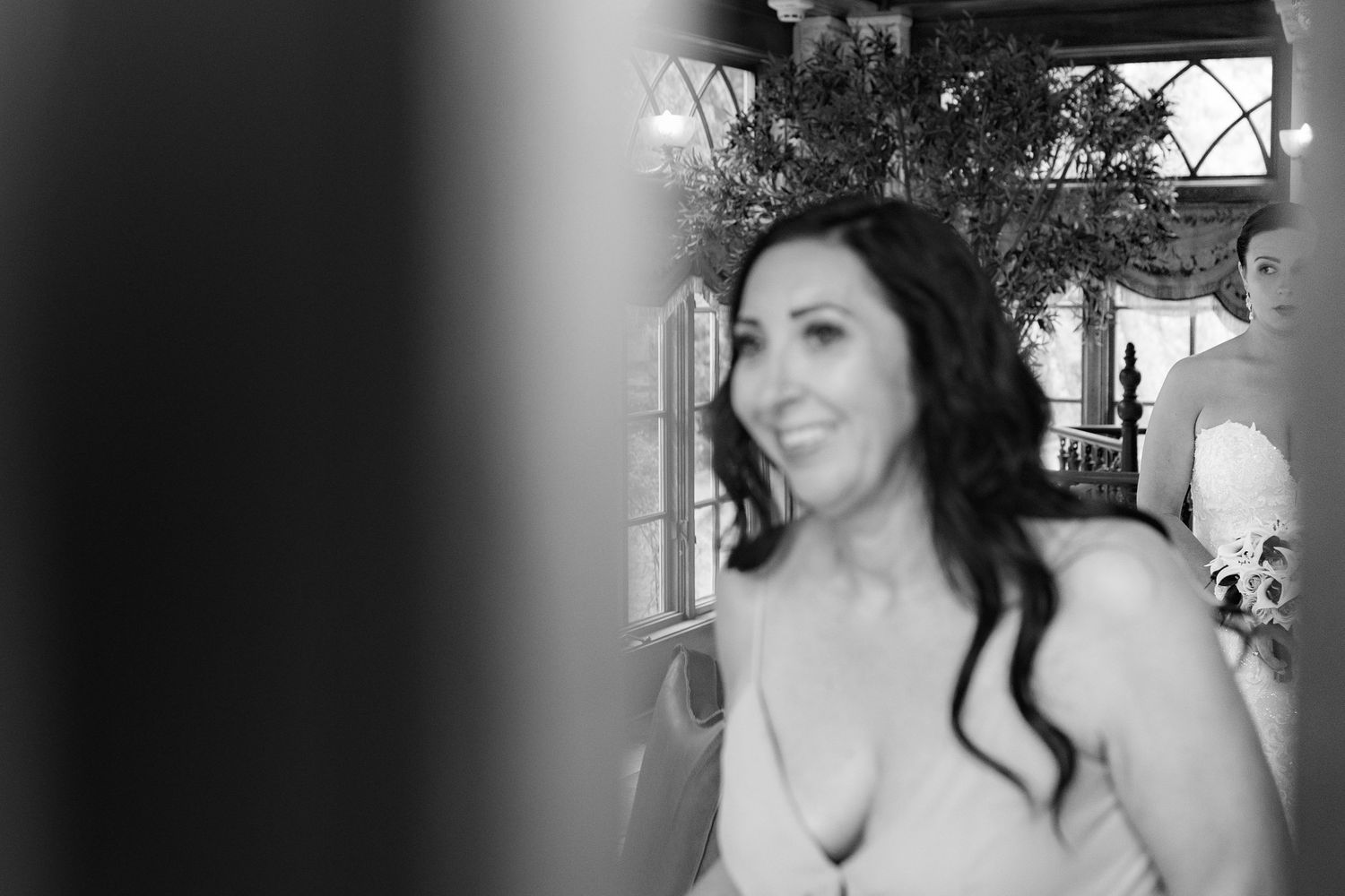 A collection of black and white wedding photos showing candid moments and details from a romantic celebration.