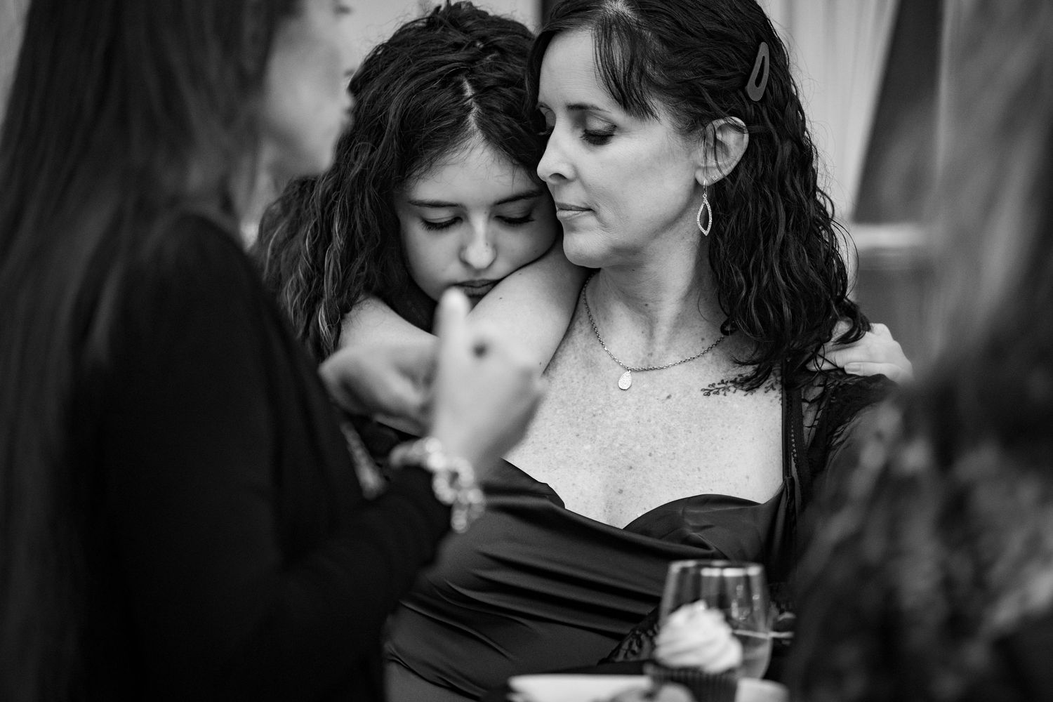 Black and white candid shots of couples dancing intimately at an elegant event.